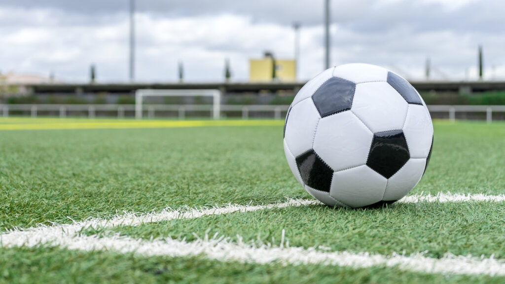 Football on pitch, Sports law.